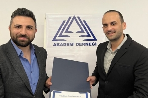 Our President Presented the First "Honorary Membership" Title to Ümit ÜNKER